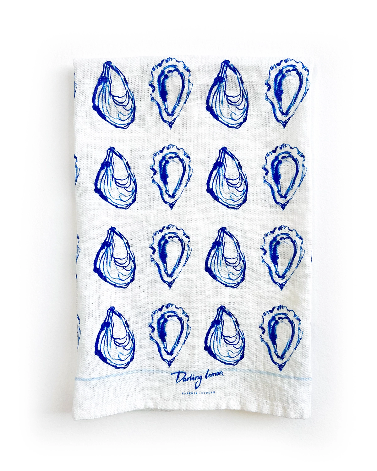 Oyster Printed Kitchen Tea Towel in White and Blue by Darling lemon