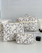 Set of floral-patterned makeup travel bags