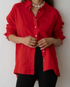 an oversized linen button up shirt in red