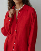 an oversized linen button up shirt in red