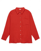 an oversized linen button up shirt in red