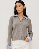 grey cardigan with blue and white stripe blouse collar and cuff