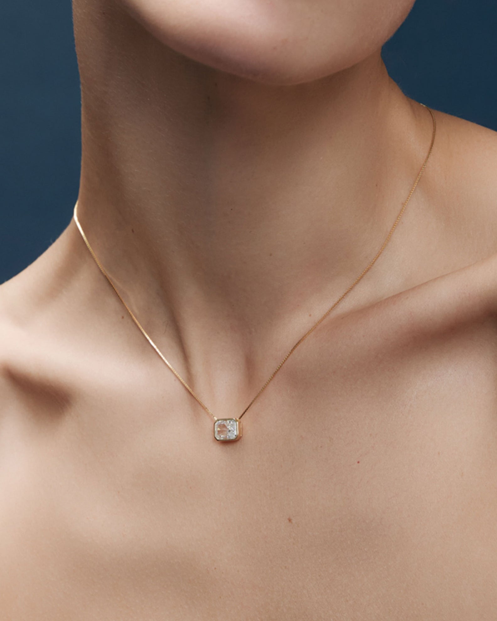 gold necklace with diamond square pendant