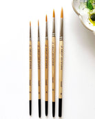 Watercolour paintbrushes with wooden handle with 'Emily Lex Studio' on them