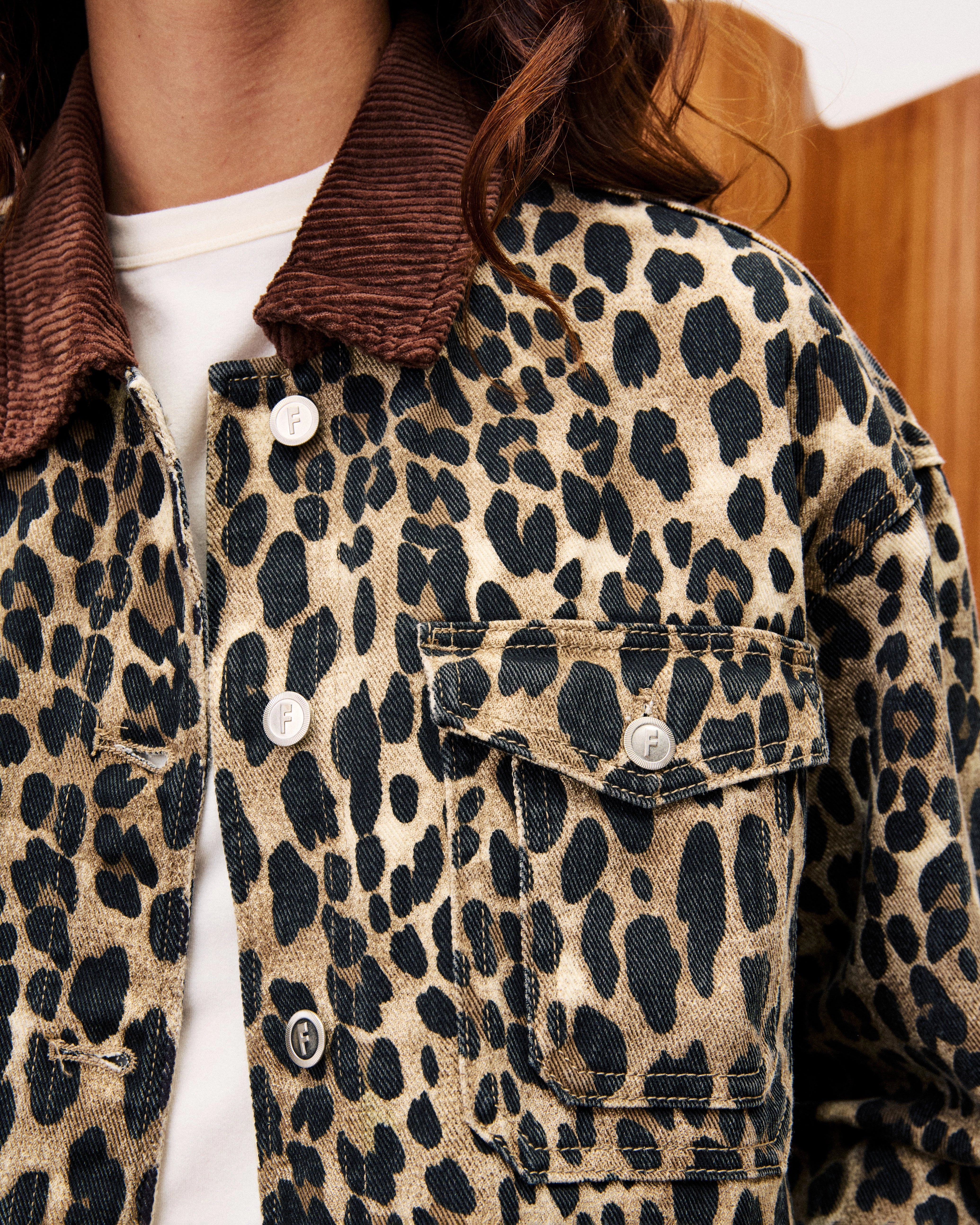close up of leopard print denim jacket