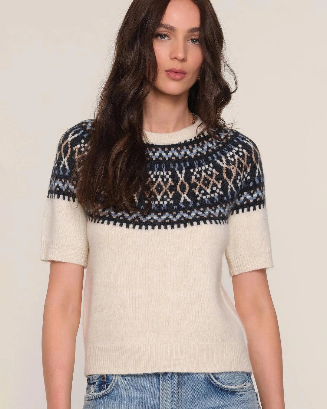 a woman wears a fairisle patterned sweater knit tee