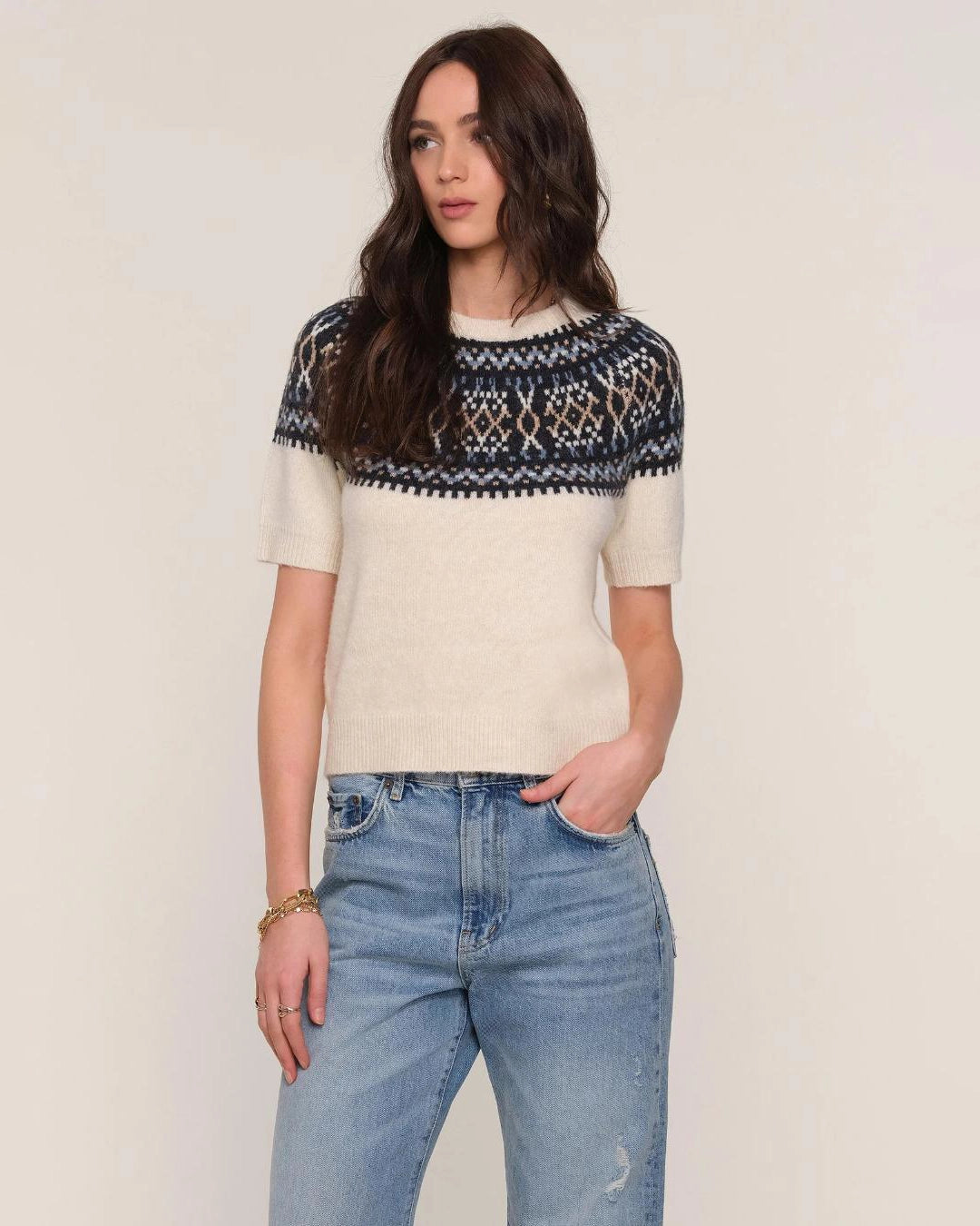 a woman wears a fairisle patterned sweater knit tee