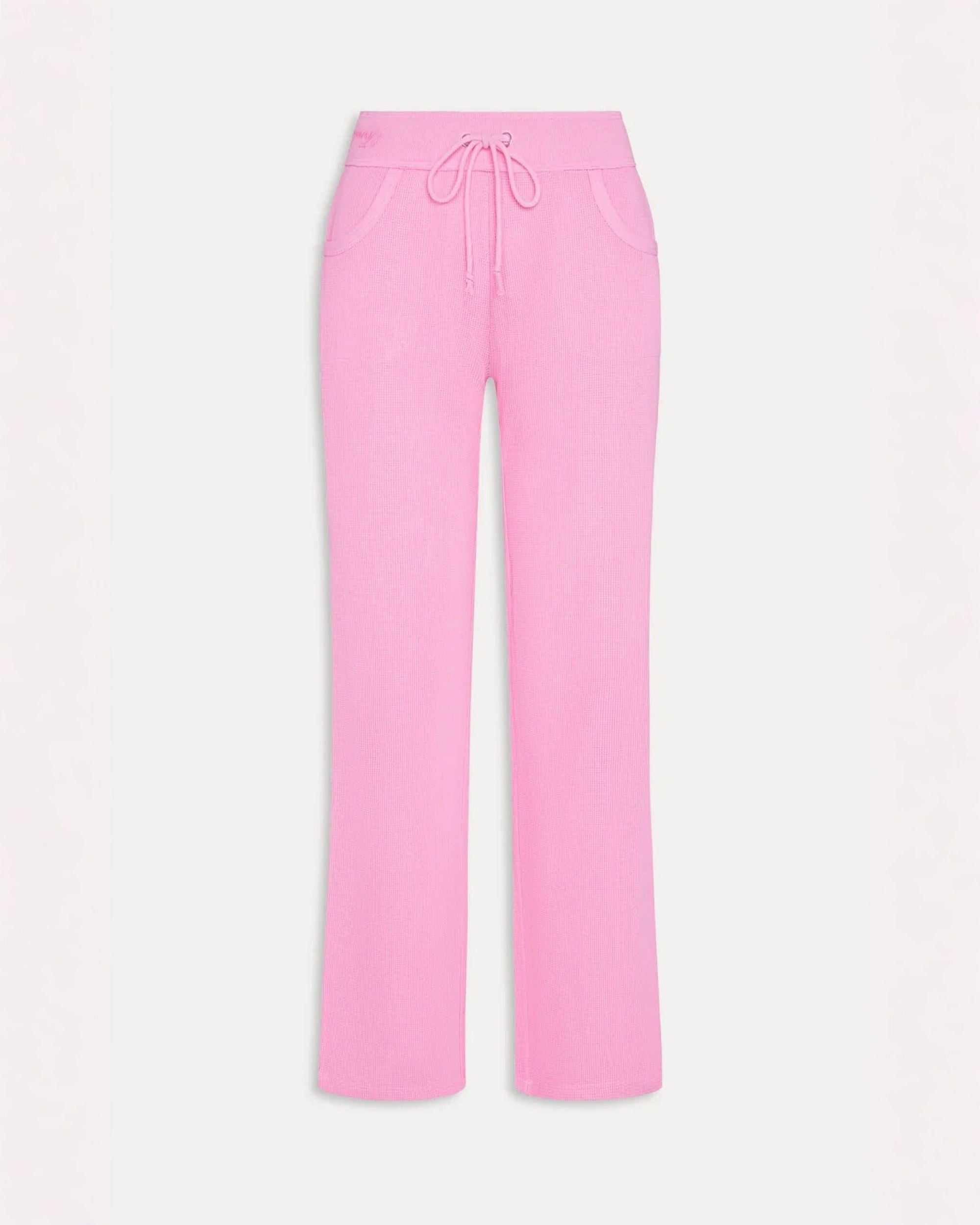 a pair of waffle knit joggers in neon pink by Frankies Bikinis