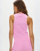 a woman wears a waffle knit tank top in neon pink by Frankie Bikinis