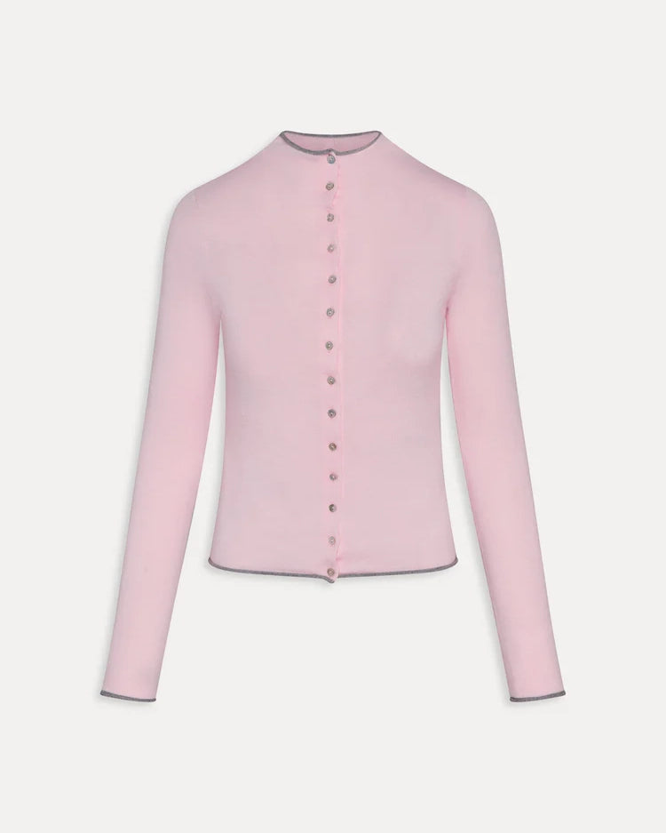 Woman wearing a pink ribbed long-sleeve button down top with grey trim