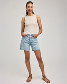 Woman wearing a beige sleeveless knitted top by Gentle Dawn