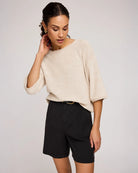 woman wearing beige knit sweater by Gentle Fawn