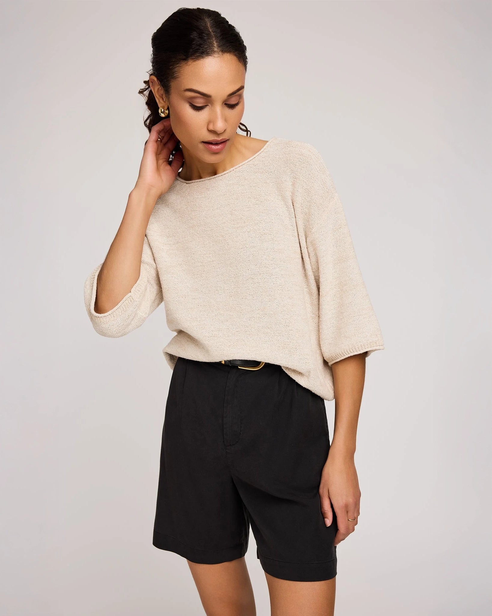 woman wearing beige knit sweater by Gentle Fawn