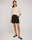 woman wearing beige knit sweater by Gentle Fawn