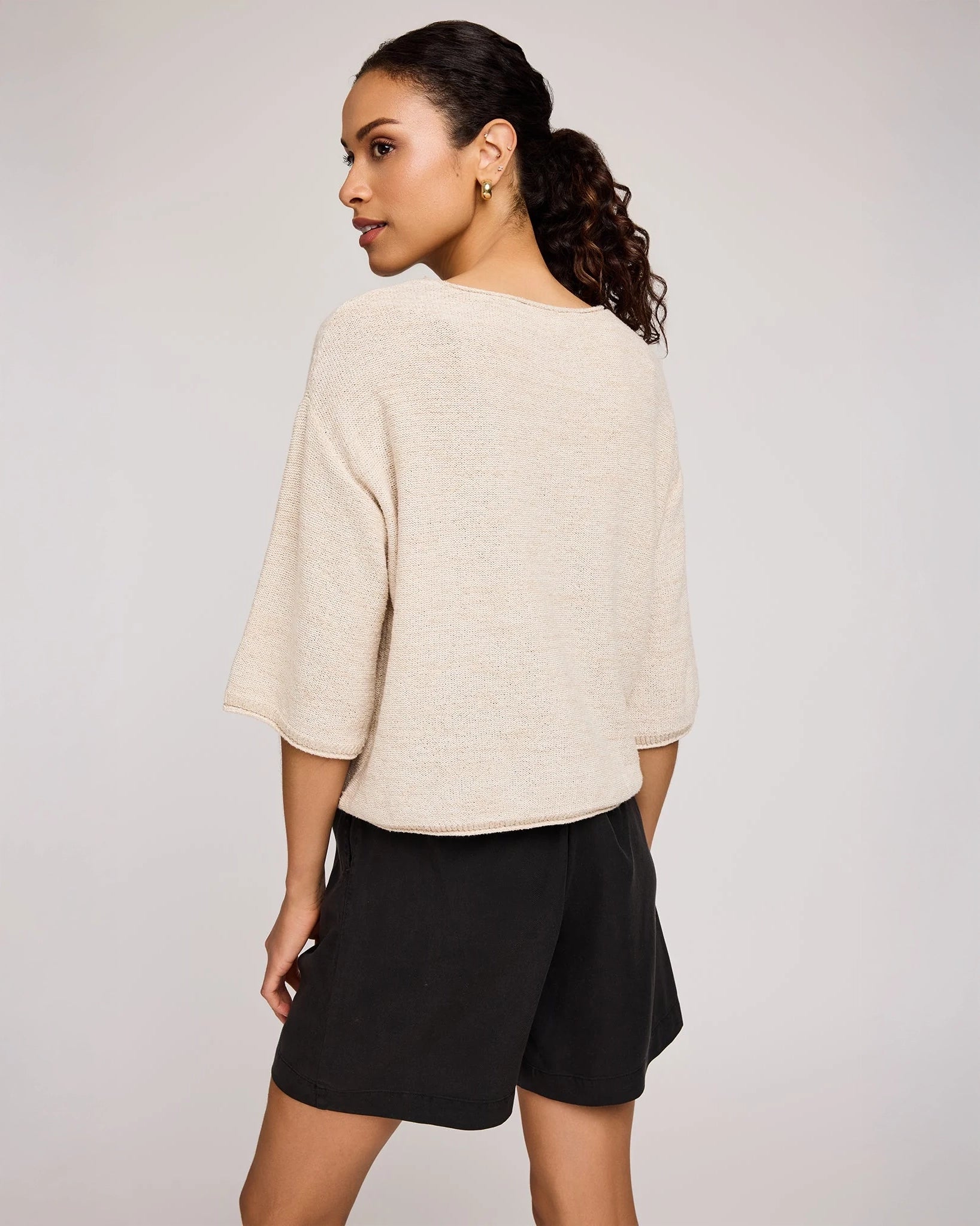 woman wearing beige knit sweater by Gentle Fawn
