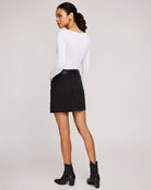 woman wearing cotton twill mini skirt in black colour by Gentle Fawn