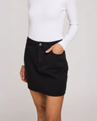 woman wearing cotton twill mini skirt in black colour by Gentle Fawn