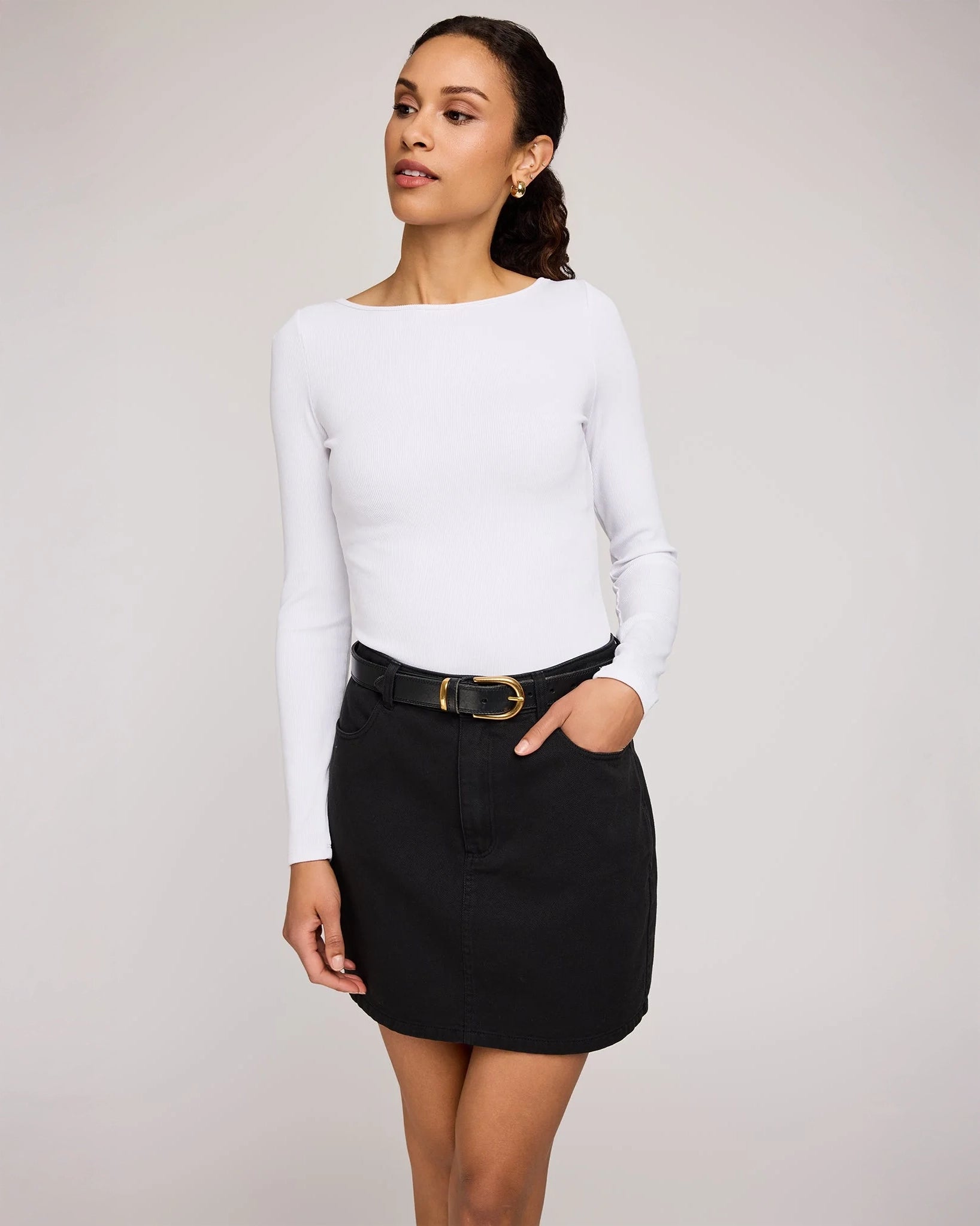 woman wearing cotton twill mini skirt in black colour by Gentle Fawn