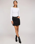 woman wearing cotton twill mini skirt in black colour by Gentle Fawn
