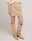 woman wearing cotton twill mini skirt in beige tan colour by Gentle Fawn