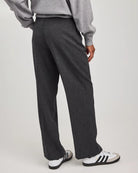 woman wearing grey tailored pants wth center pleat