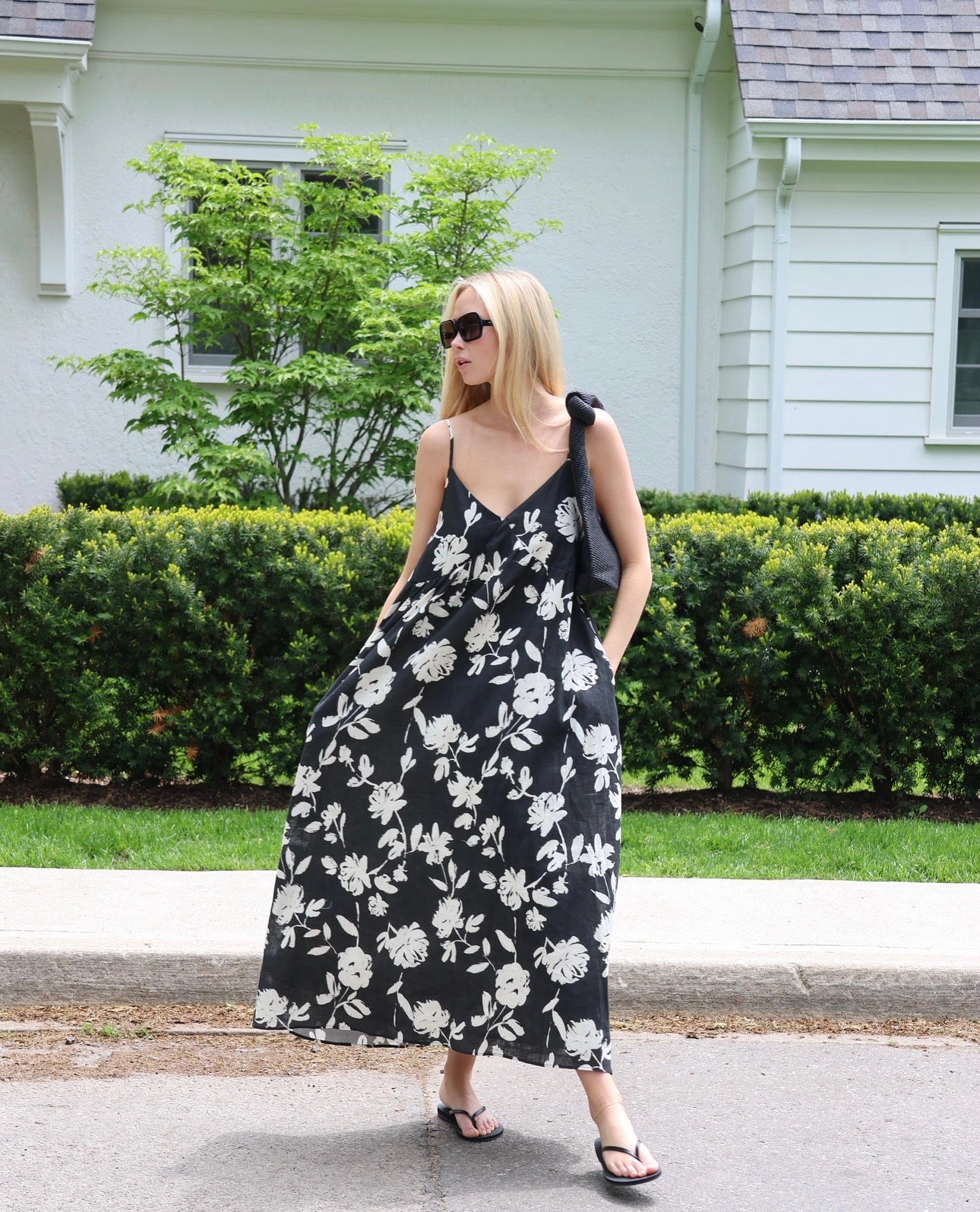 Woman wearing a black and white floral dress