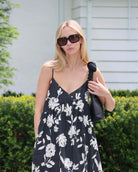 Woman wearing a black and white floral dress