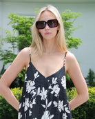 Woman wearing a black and white floral dress