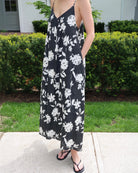 Woman wearing a black and white floral dress
