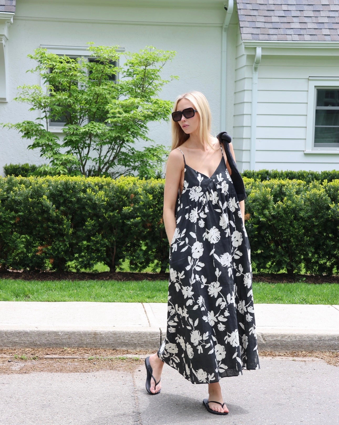 Woman wearing a black and white floral dress
