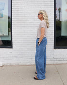 Woman wearing a beige linen t-shirt