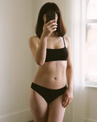 woman wearing black bikini underwear in modal by Huha with matching bralette