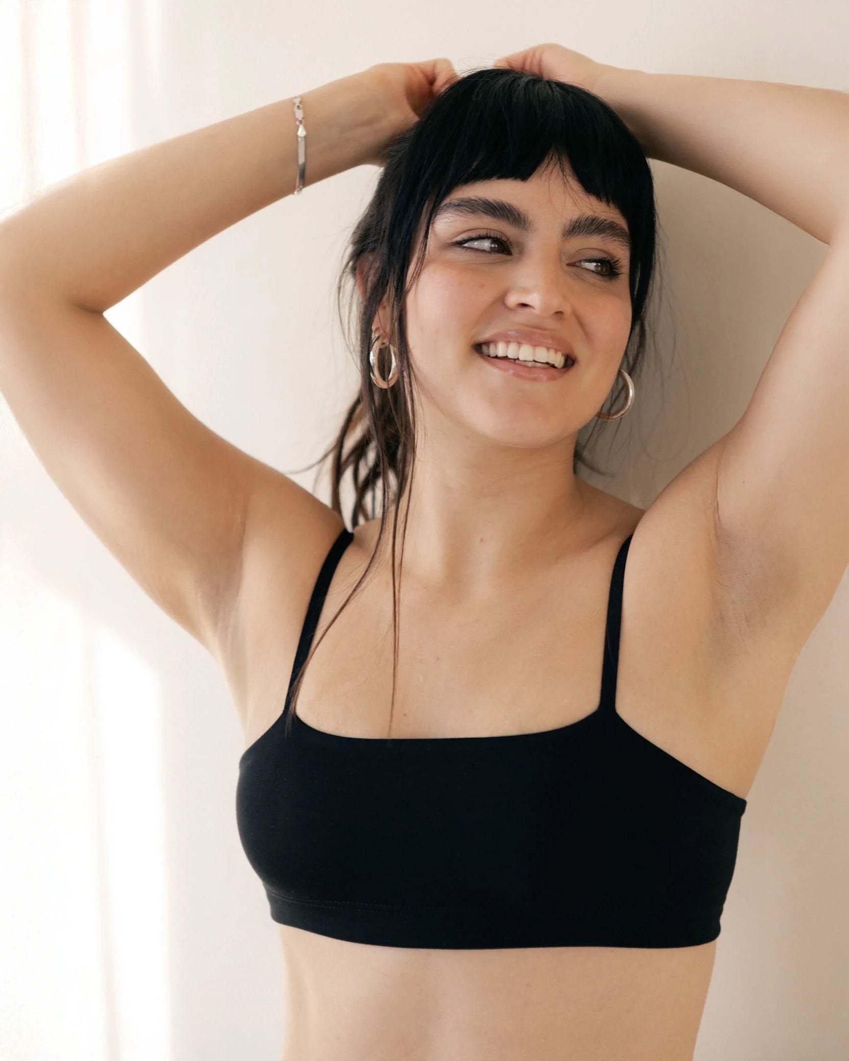 Woman in a black bandeau sports modal bralette