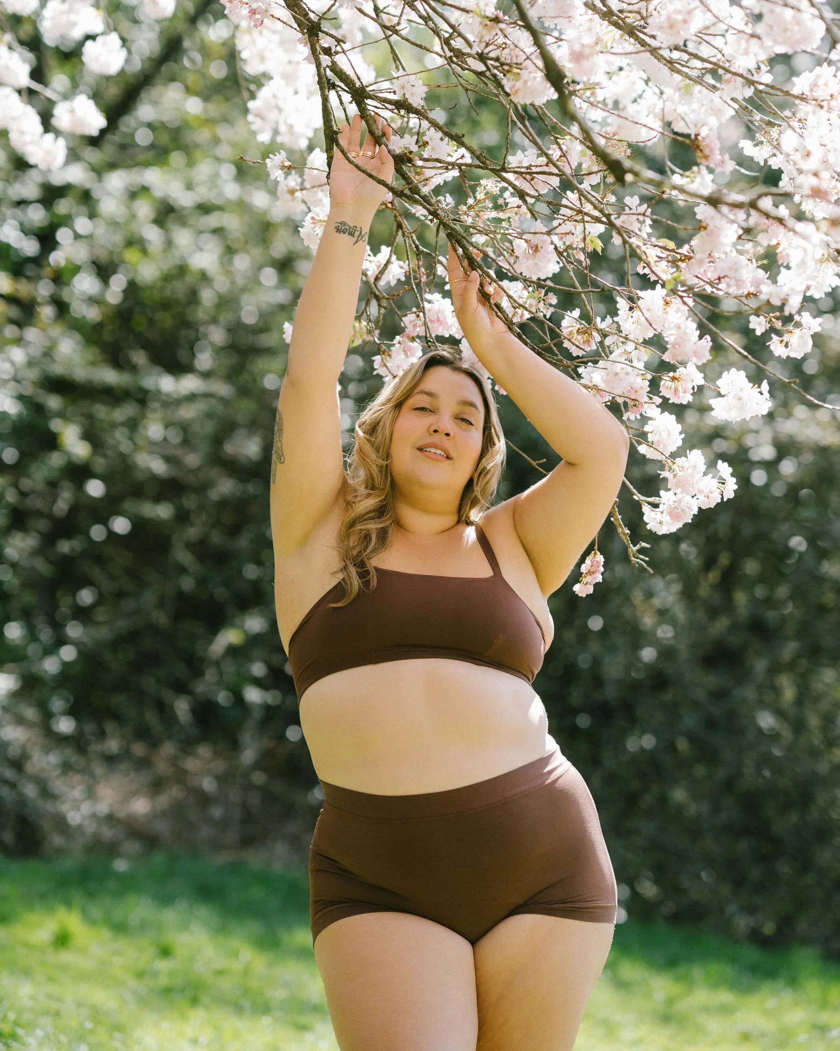 Woman in a brown bandeau sports modal bralette and undies