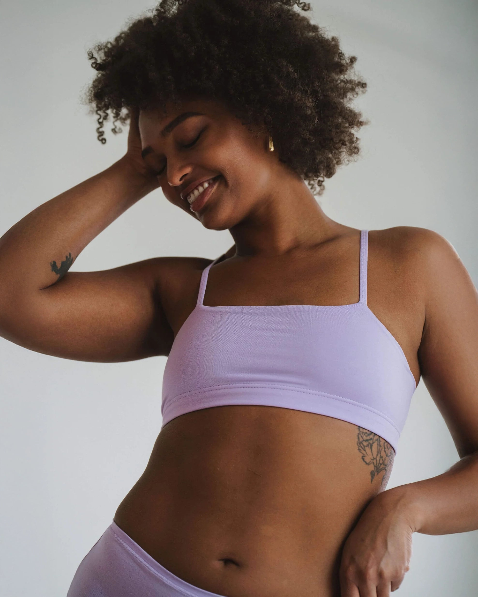 Woman in a light purple bandeau sports modal bralette