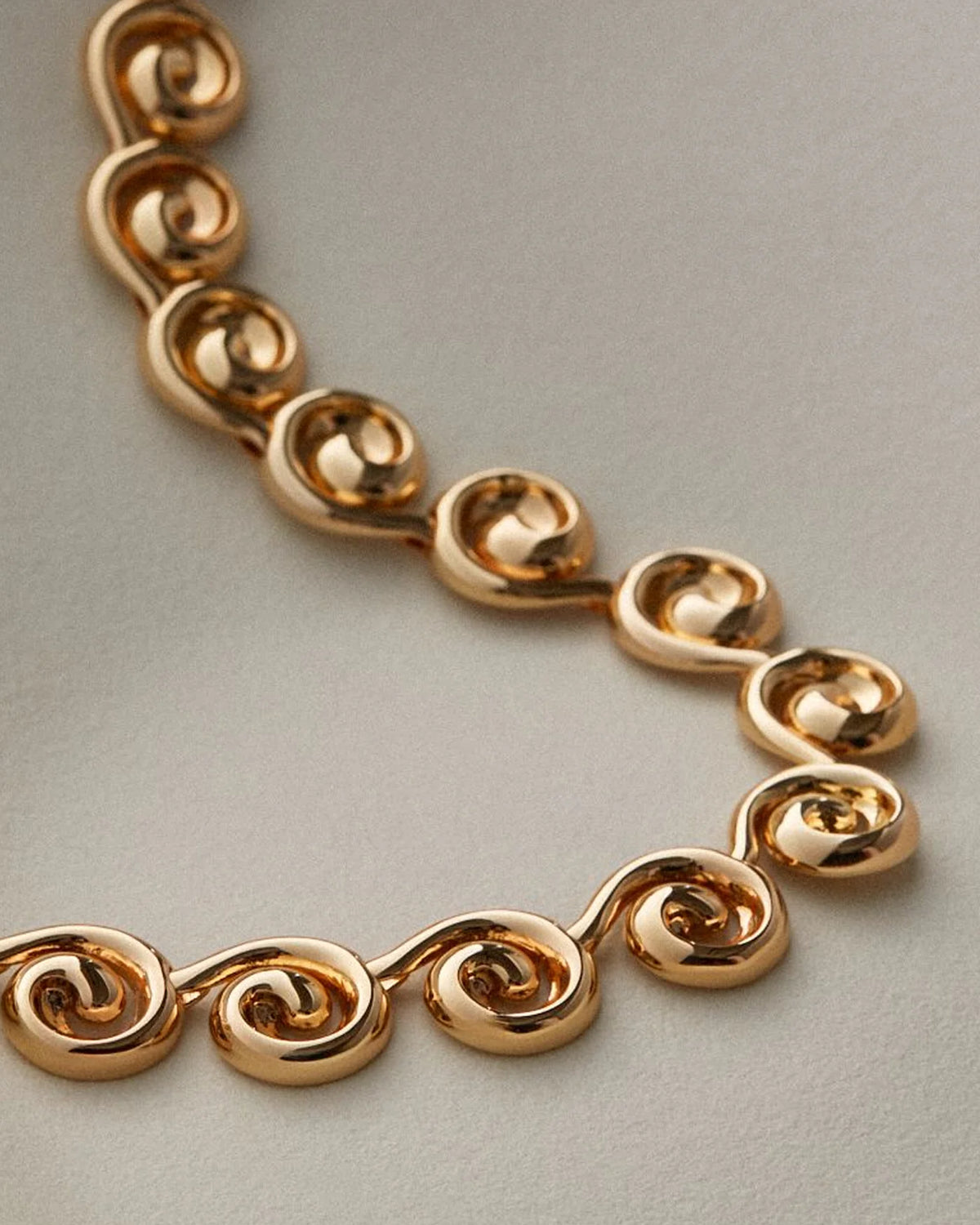 gold swirl statement necklace