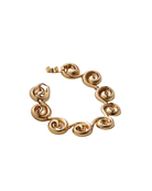 chunky statement gold bracelet with swirl details