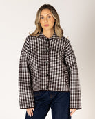 short coat in brown and white houndstooth design