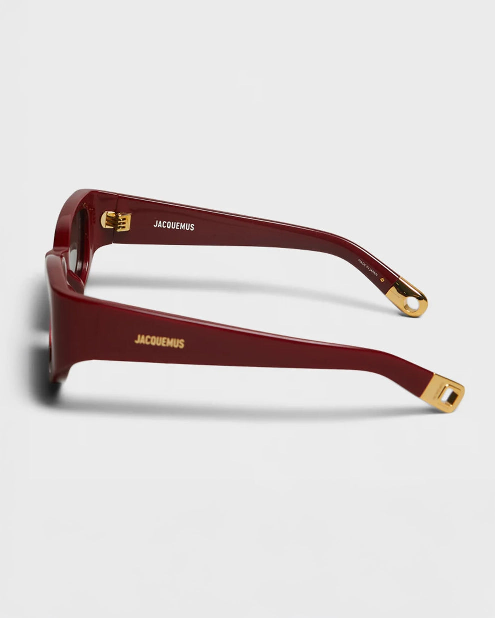 Jaquemus Gala Sunglasses in Burgundy showing gold detailing
