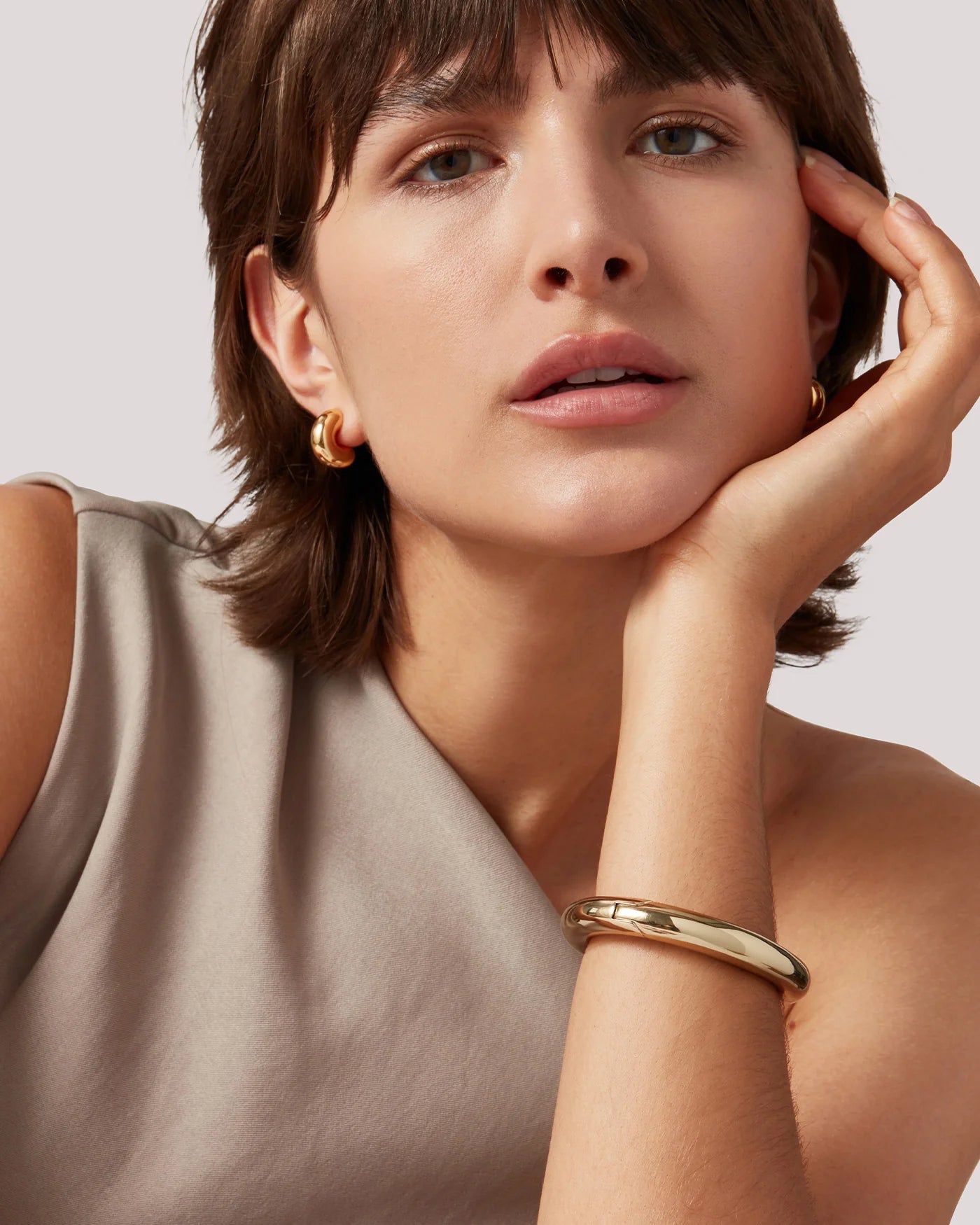 Chunky gold Gia Mega bangle bracelet by Jenny Bird