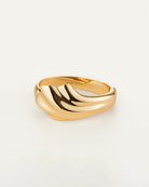 Gold solid cuff bracelet with a wavy design