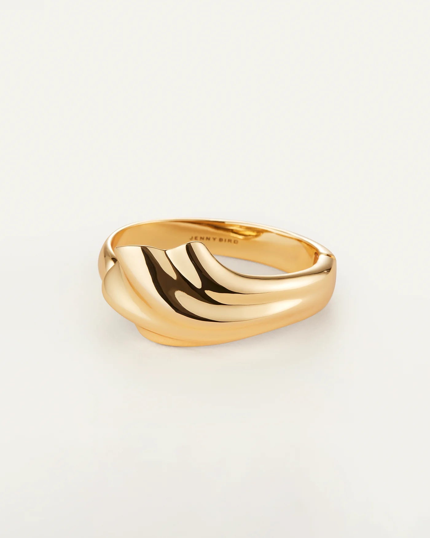 Gold solid cuff bracelet with a wavy design