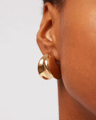 gold statement earrings by Jenny Bird