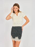 Short sleeve cream knit sweater with a collar 