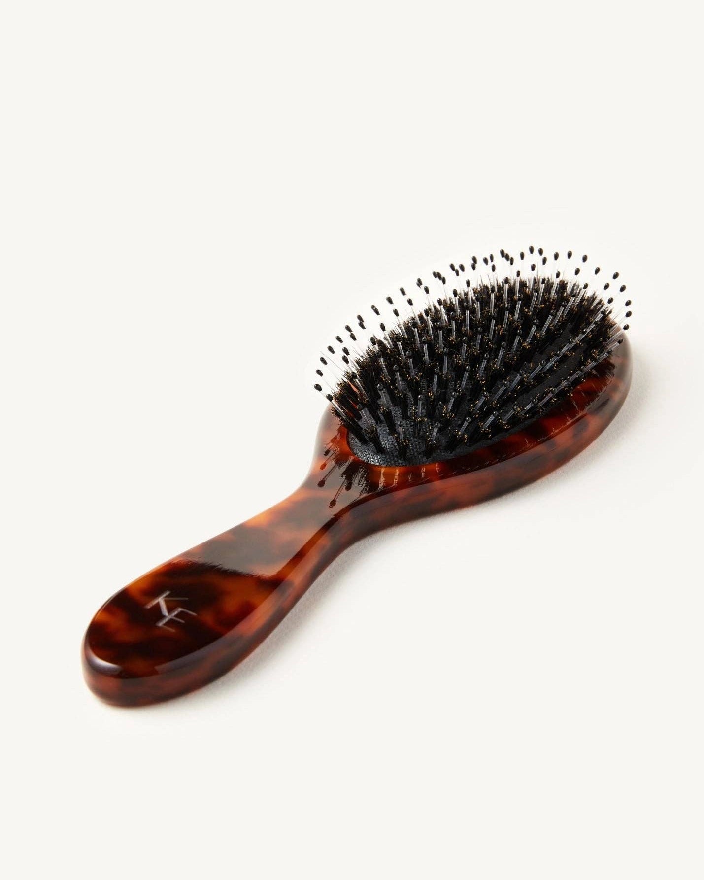 Tortoiseshell hairbrush with black bristles