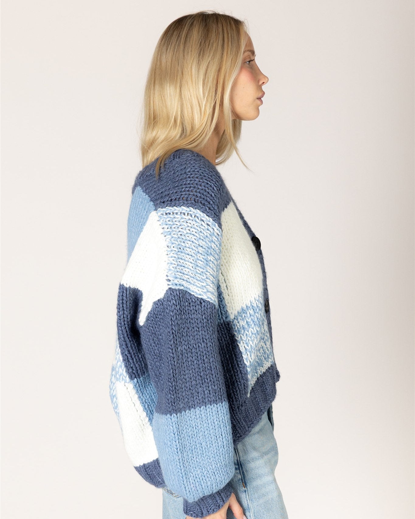 chunky knit cardigan with large checkered print in blue and white