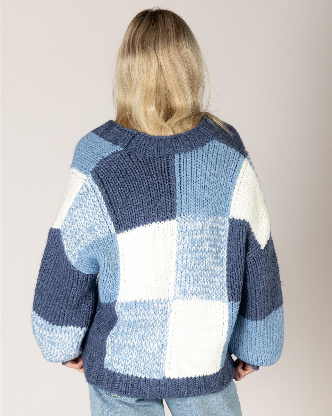 chunky knit cardigan with large checkered print in blue and white