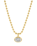 A gold chain necklace with a big oval crystal pendant by brand Lili Claspe