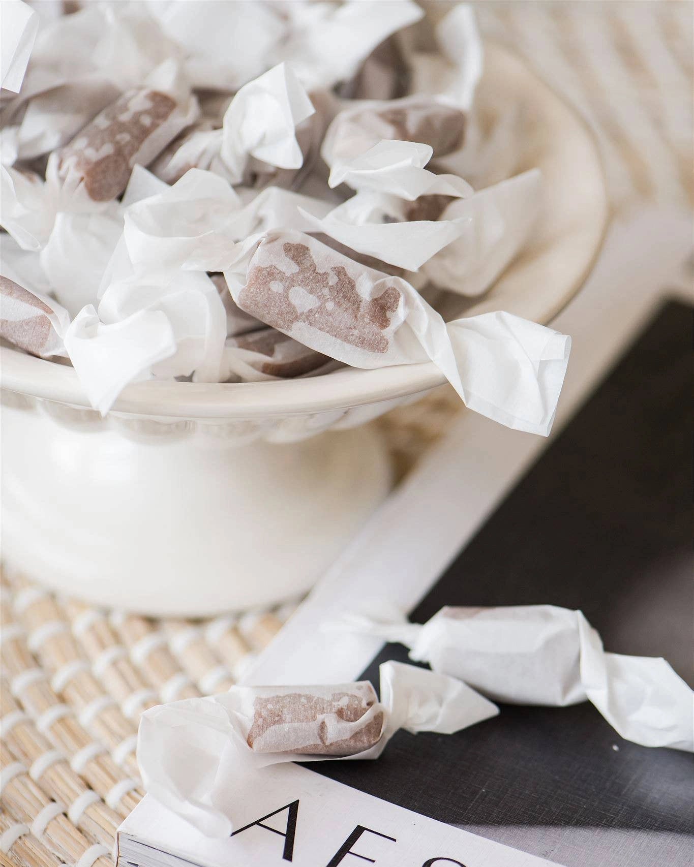 Caramel candies in white wrappers