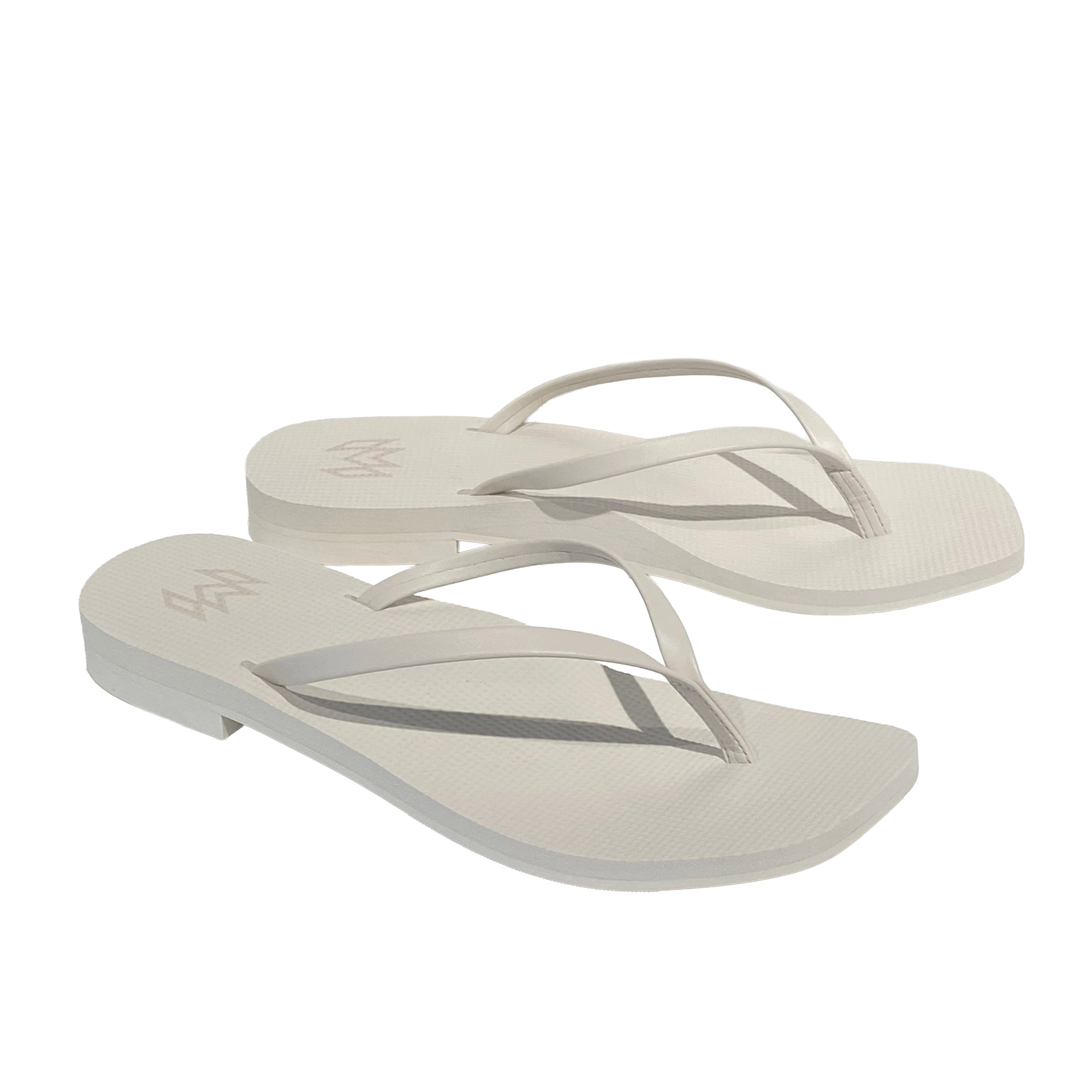 off white flip flops with a square toe